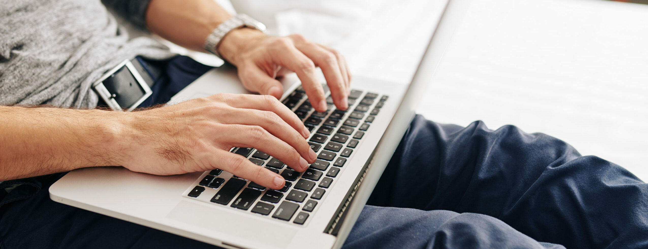 Man typing on laptop computer