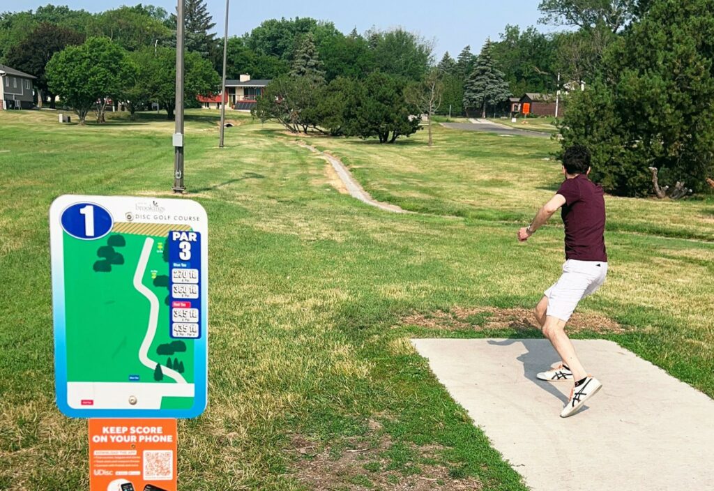 Larson Park where a player is engaging in a game of frisbee golf.