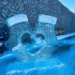 Two mittens with a heart in the middle carved from ice in Downtown Brookings